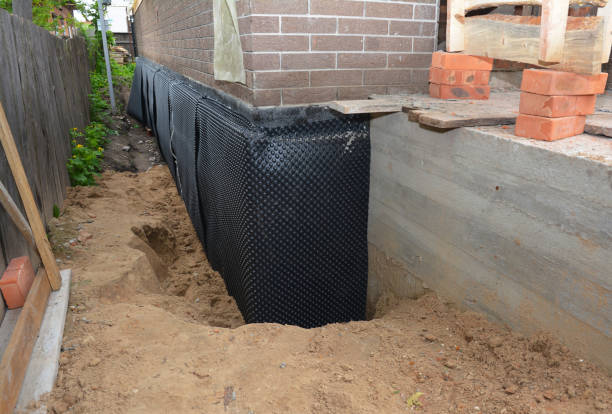 SJ Waterproofing Pros technician performing targeted Exterior Waterproofing assessment in Brookville, PA